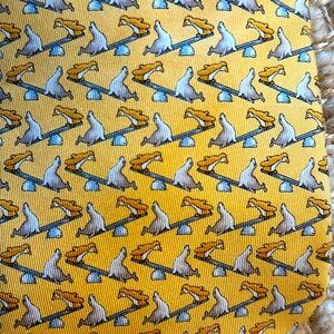 Salvatore Ferragamo yellow, penguin and seal silk tie in good condition!